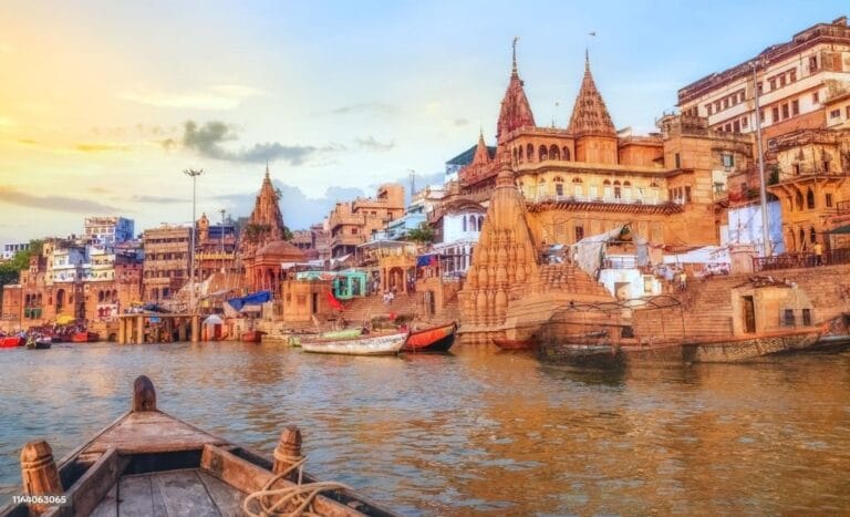 Evening view of Varanasi Ghats lit with golden light by the Ganga River