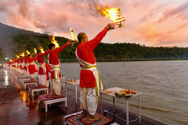 Priests performing evening Ganga Aarti in Rishikesh