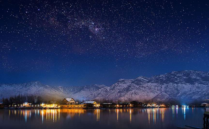 Night view of Amarnath Temple with mountain reflections