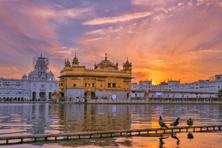 Golden Temple Amritsar at sunset with reflection in Amrit Sarovar
