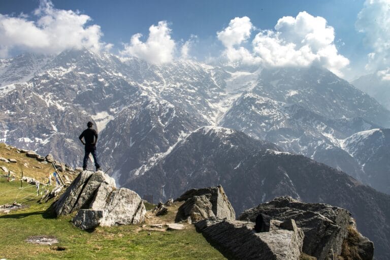 Traveler enjoying the panoramic view at Triund Trek Dharamshala Himachal Pradesh